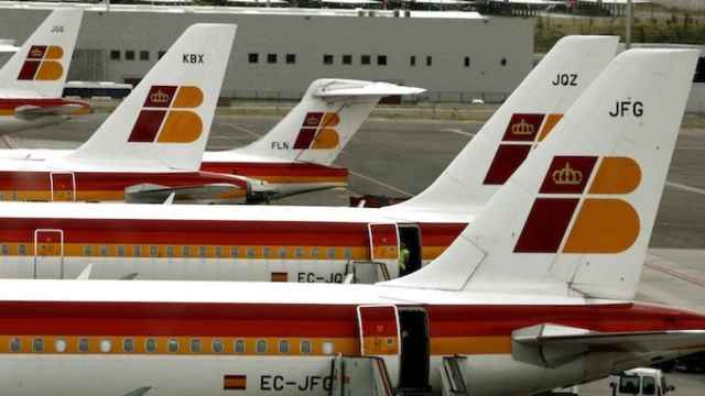 File phto of planes pf Spanish airline Iberia parked on the tarmac of Madrid's Barajas airport