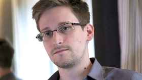 Former U.S. spy agency contractor Edward Snowden is interviewed by The Guardian in his hotel room in Hong Kong...Former U.S. spy agency contractor Edward Snowden is seen in this still image taken from video during an interview by The Guardian in his hotel room in Hong Kong June 6, 2013. Snowden was on July 24, 2013 granted documents that will allow him to leave a Moscow airport where he is holed up, an airport source said on Wednesday. The official, who spoke on condition of anonymity, said Snowden, who is wanted by the United States for leaking details of U.S. government intelligence programmes, was expected to meet his lawyer at Sheremetyevo airport later on Wednesday after lodging a request for temporary asylum in Russia. The immigration authorities declined immediate comment. Picture taken June 6, 2013. MANDATORY CREDIT. REUTERS/Glenn Greenwald/Laura Poitras/Courtesy of The Guardian/Handout via Reuters (CHINA - Tags: POLITICS MEDIA) ATTENTION EDITORS - THIS IMAGE WAS PROVIDED BY A THIRD PARTY. FOR EDITORIAL USE ONLY. NOT FOR SALE FOR MARKETING OR ADVERTISING CAMPAIGNS. NO SALES. NO ARCHIVES. THIS PICTURE IS DISTRIBUTED EXACTLY AS RECEIVED BY REUTERS, AS A SERVICE TO CLIENTS. NO THIRD PARTY SALES. NOT FOR USE BY REUTERS THIRD PARTY DISTRIBUTORS. MANDATORY CREDIT