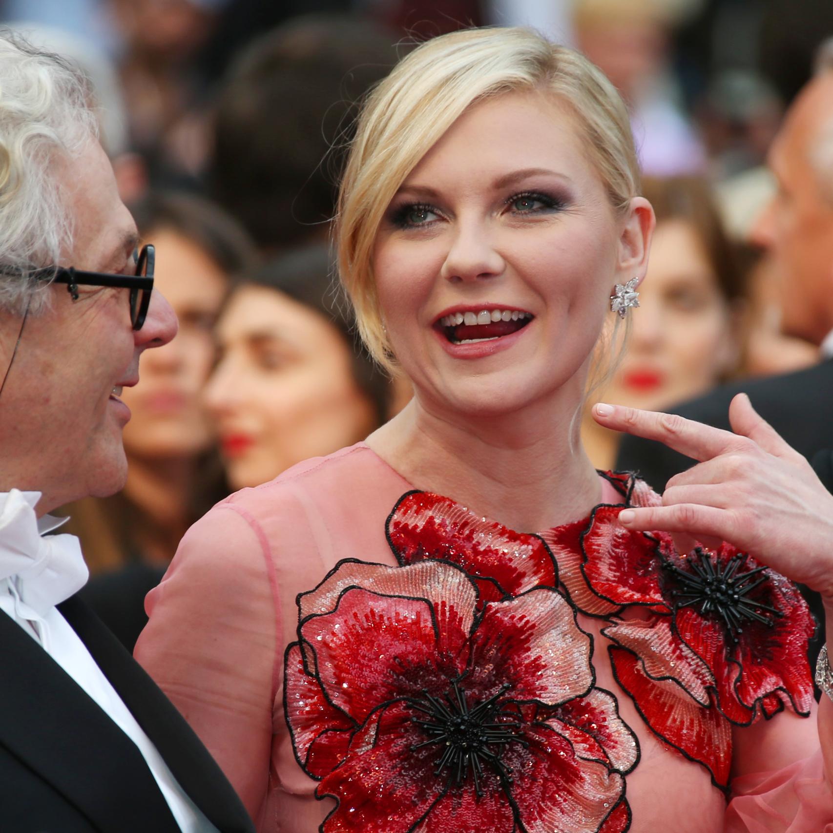 Kirsten Dunst con el presidente del jurado de Cannes, Jury George Miller