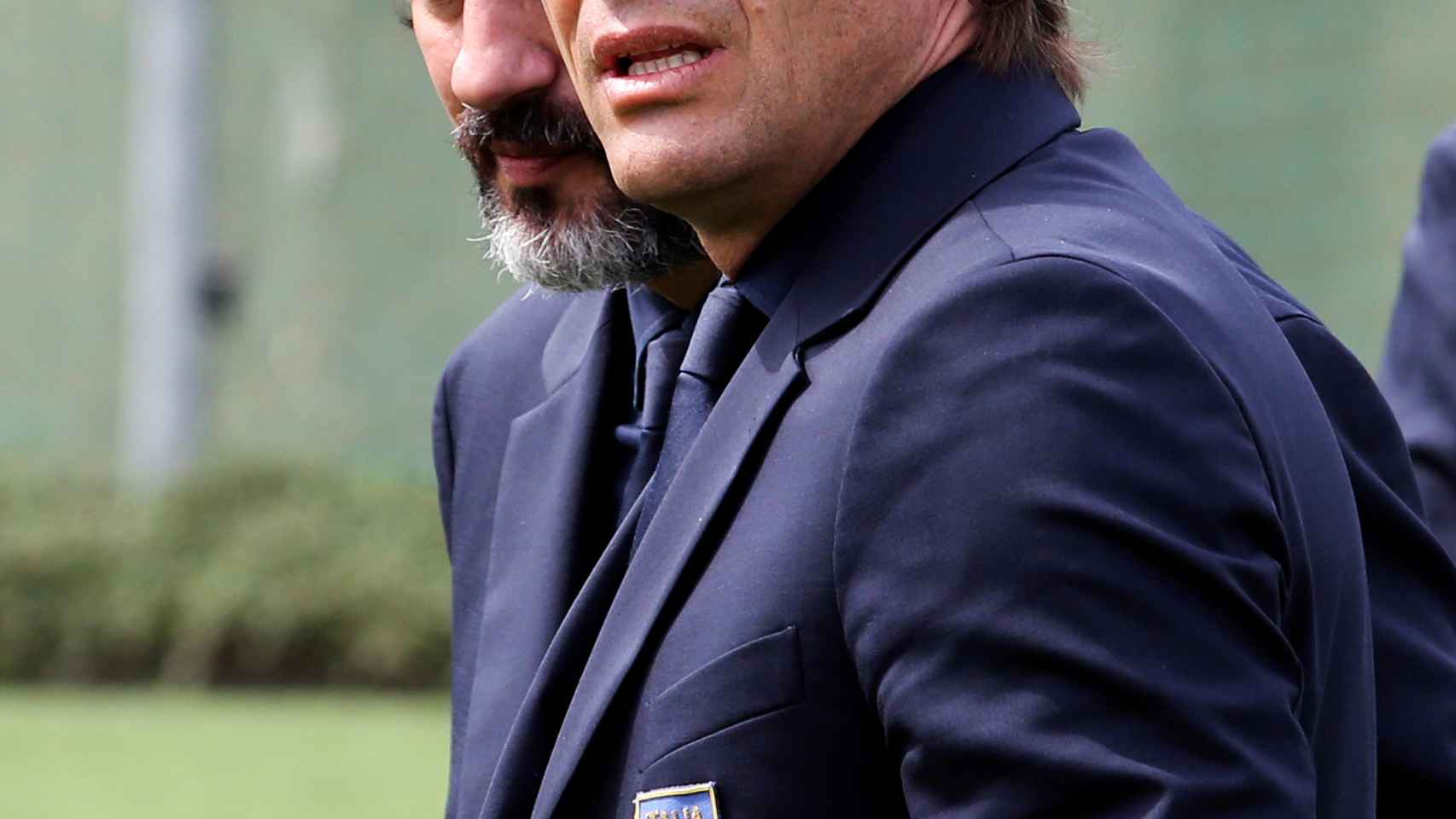 Italy's coach Antonio Conte looks on after posing for the Italy national soccer team official photo, at the Coverciano training center, near Florence