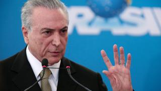 Brazil's interim President Michel Temer gestures during the inauguration ceremony of new presidents of state companies, at the Planalto Palace in Brasilia