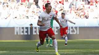 Poland's Arkadiusz Milik celebrates after scoring their first goal