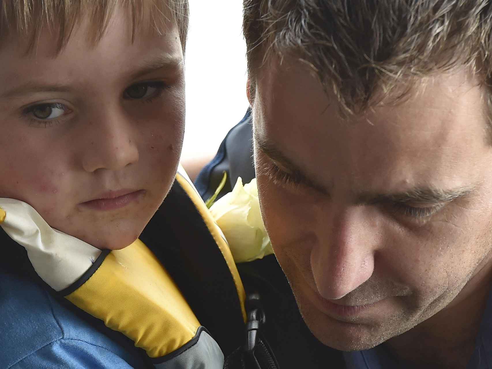 Brendan Cox, the husband of murdered Labour Party MP Jo Cox, travels by boat along the River Thames with their son to attend a service at Trafalgar Square