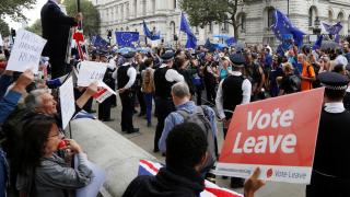 Brexit supporters form a counter demonstration as Pro-Europe demonstrators protest during a March for Europe against the Brexit vote result earlier in the year, in London, Britain