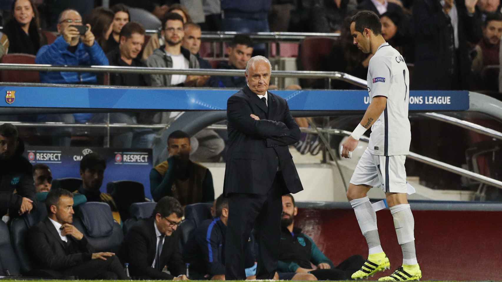 Manchester City's Claudio Bravo walks past Barcelona coach Luis Enrique looking dejected after being sent off
