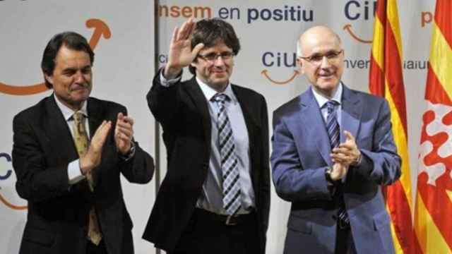 De izda. a dcha: Artur Mas, Carles Puigdemont y Josep Duran Lleida en un acto de CiU de 2011.