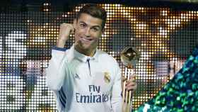 Real Madrid's Cristiano Ronaldo celebrates with the Golden Ball trophy