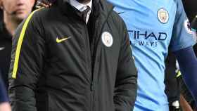 Manchester City manager Pep Guardiola and Yaya Toure after the game
