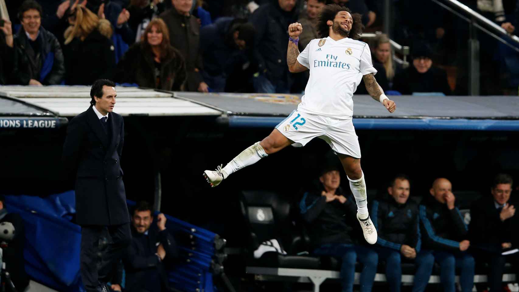 Marcelo celebra el 3-1 ante un Unai Emery cabizbajo y derrotado otra vez en el Bernabéu. / Reuters