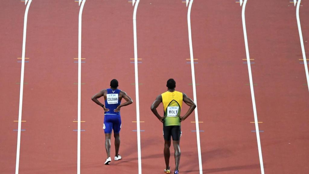 Christian Coleman y Usain Bolt tras la final de los 100 metros del Mundial 2017