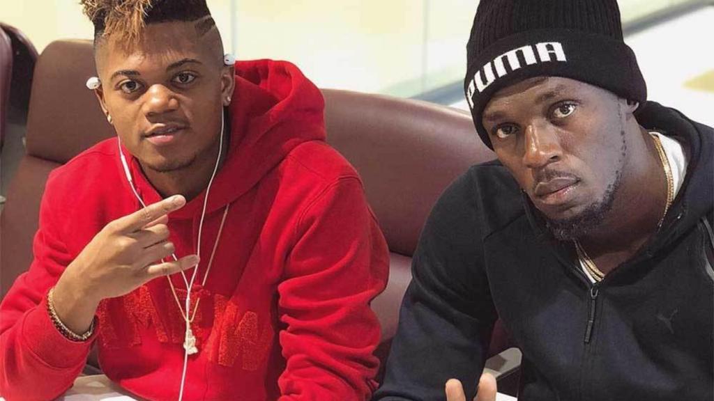 Leon Bailey junto a Usain Bolt.