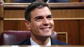 FILE PHOTO: Spain's Socialist (PSOE) leader Pedro Sanchez smiles from his seat before the final day of a motion of no confidence debate in Parliament in Madrid