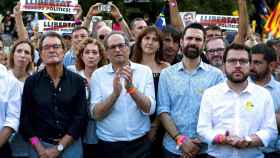 Artur Mas, Quim Torra y Roger Torrent, durante la manifestación en las calles de Barcelona.