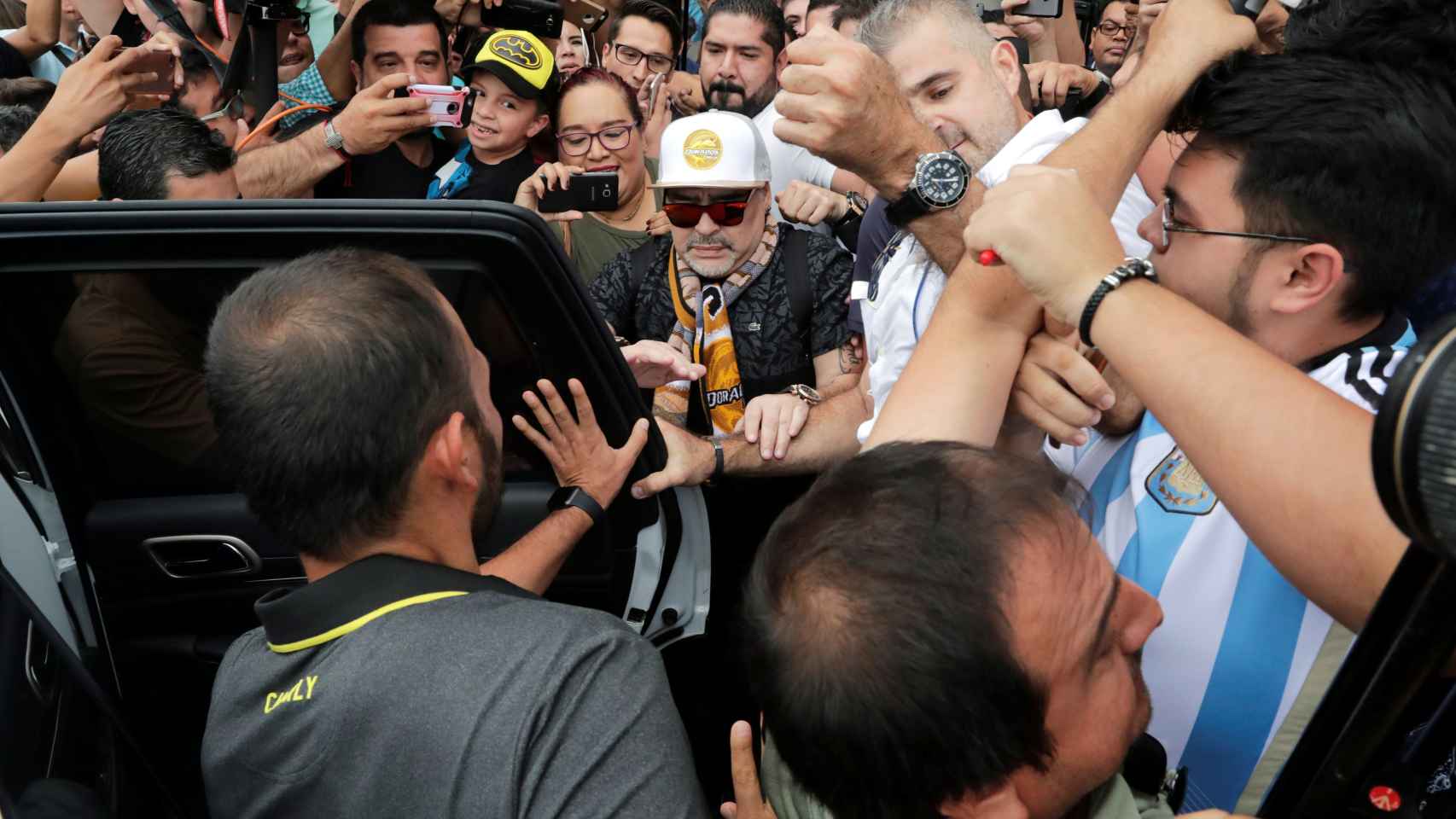 Argentine soccer legend Diego Maradona who was named head coach of Mexican second division team Dorados arrives at the airport in Culiacan