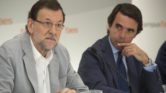 Mariano Rajoy y José María Aznar en 2013.