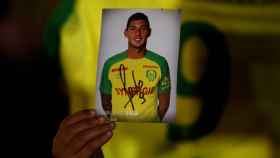 A fan holds a portrait of Emiliano Sala in Nantes' city center after news that newly-signed Cardiff City soccer player Emiliano Sala was missing after the light aircraft he was travelling in disappeared between France and England