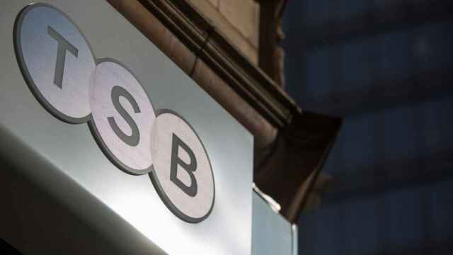 FILE PHOTO: A sign is displayed outside a branch of the TSB bank in central London