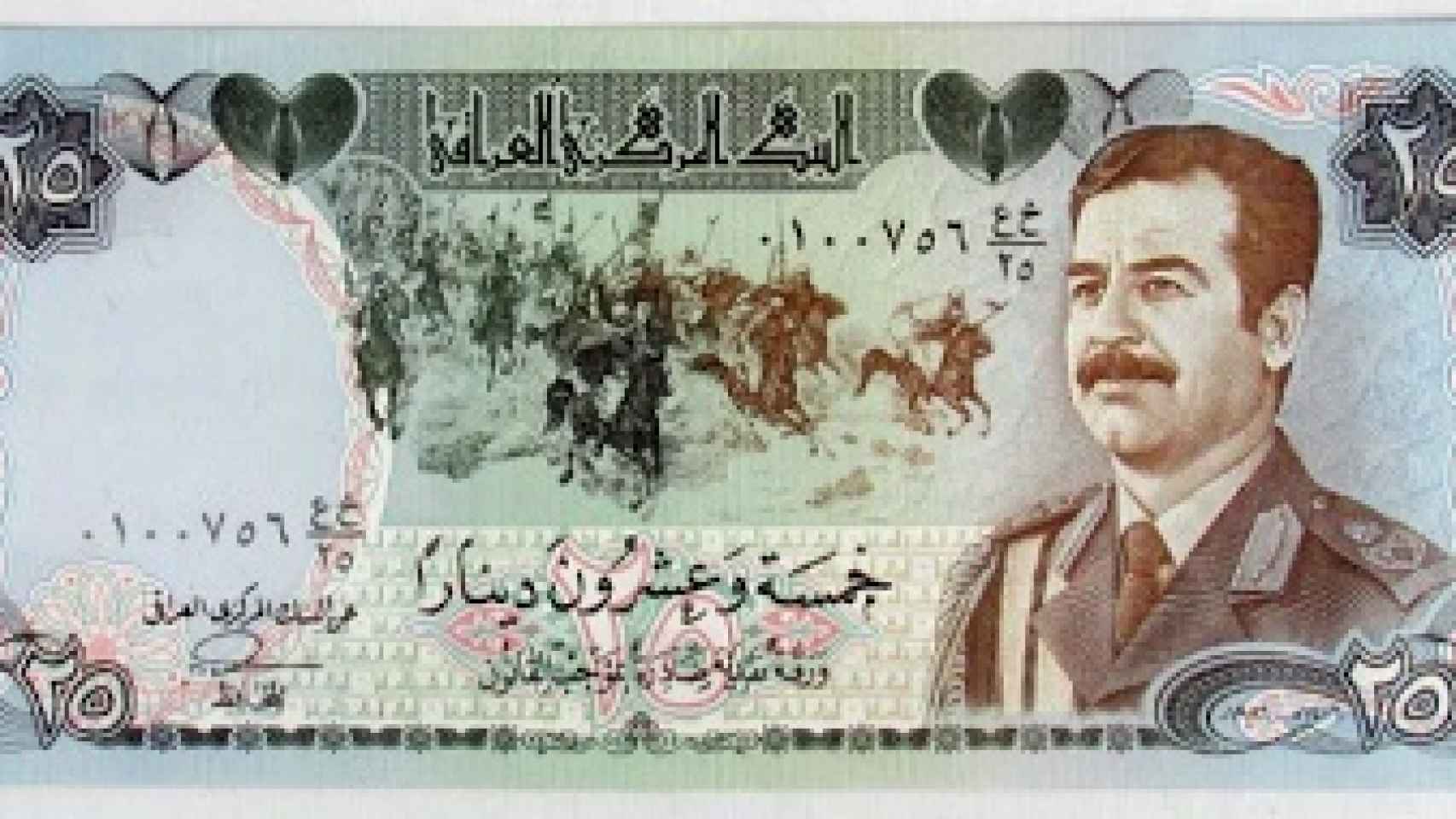Un antiguo dinar iraquí con el rostro de Sadam Hussein.