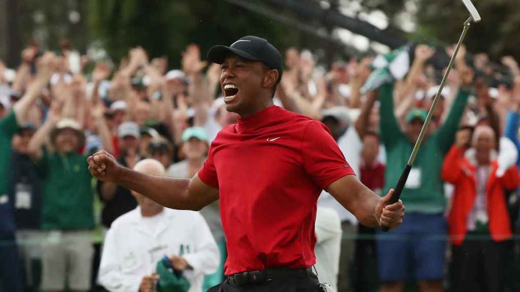 Tiger Woods celebra un nuevo Major