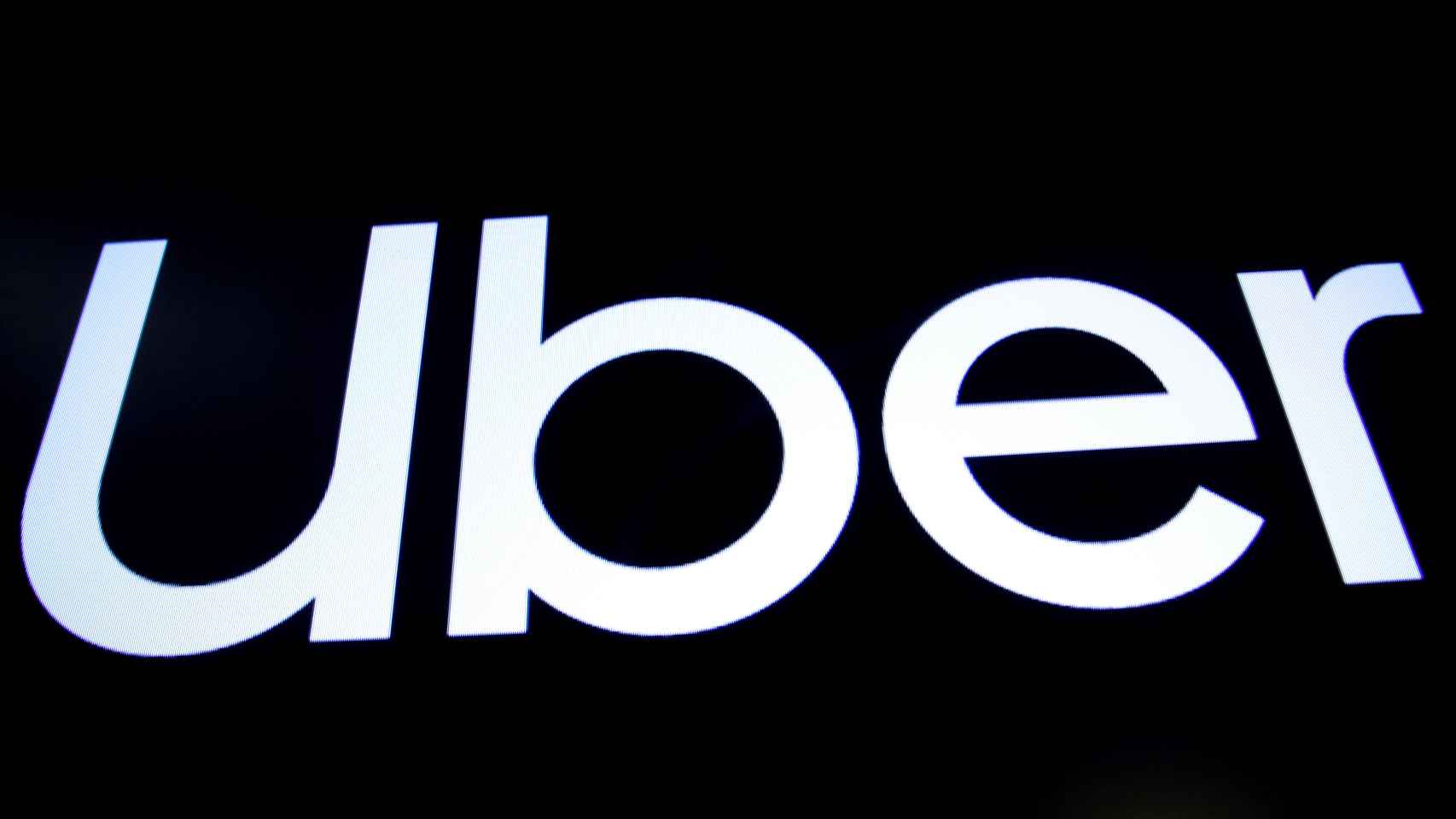FILE PHOTO: A screen displays the company logo for Uber Technologies Inc. on the day of its IPO at the NYSE in New York