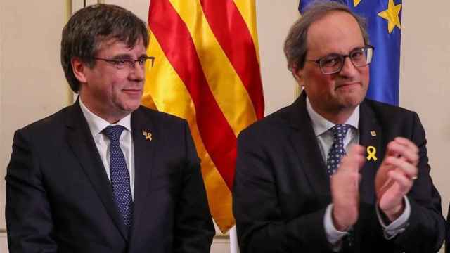 Carles Puigdemont, expresidente de la Generalitat junto a Quim Torra, actual presidente de la Generalitat.