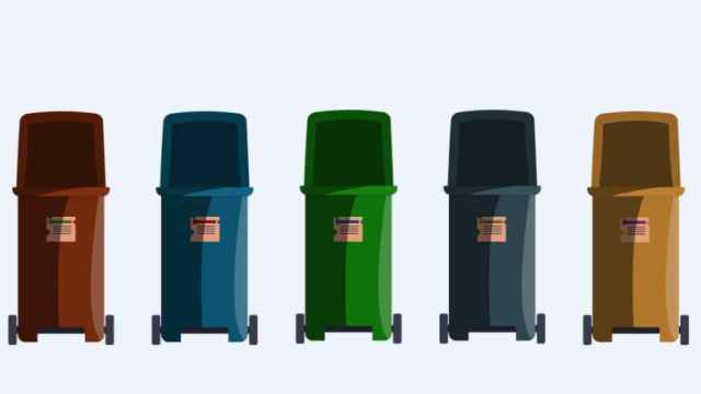 Una ilustración de cinco contenedores de reciclaje.