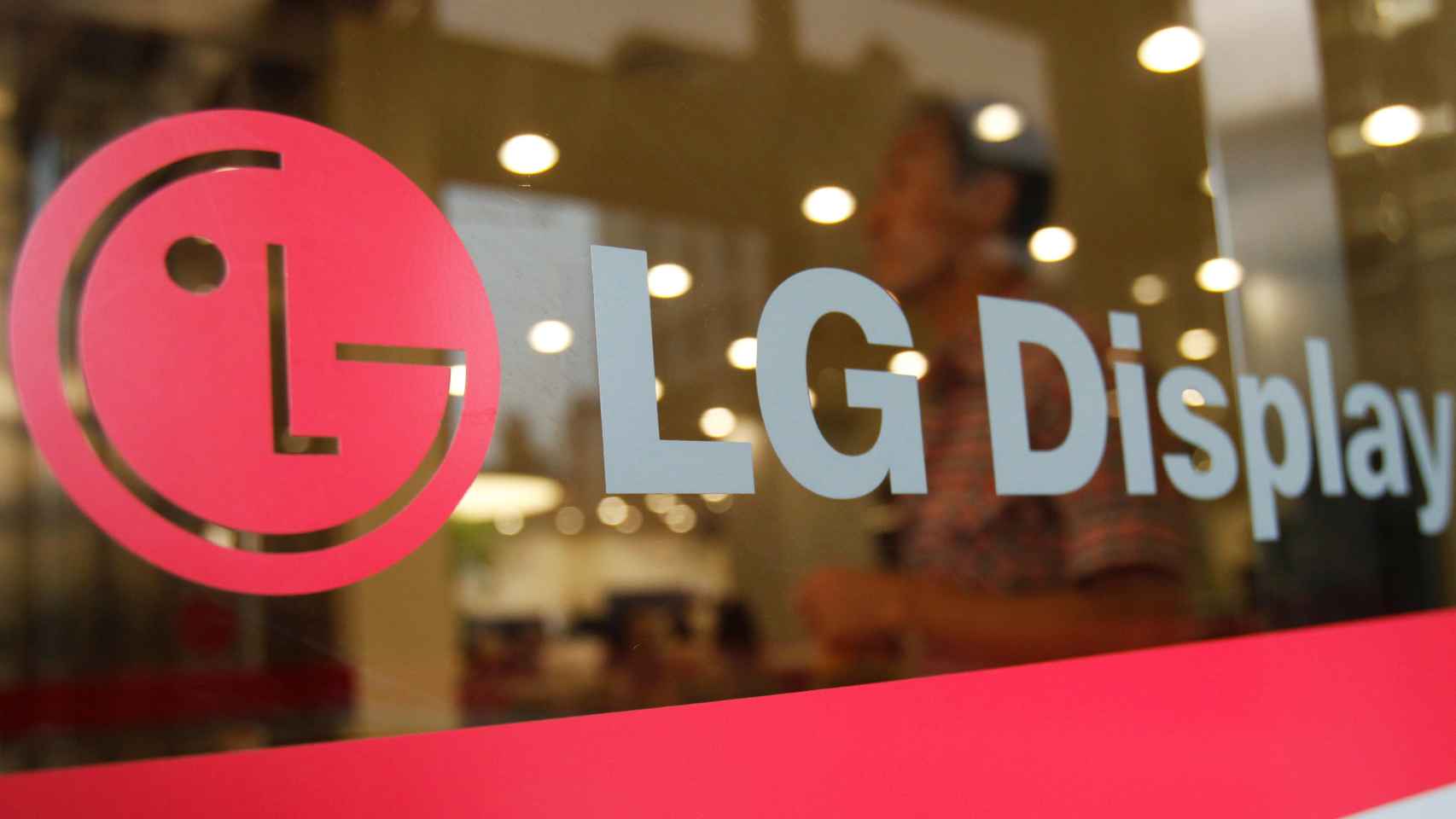 FILE PHOTO: An employee of LG Display walks at the company's main office building in Seoul