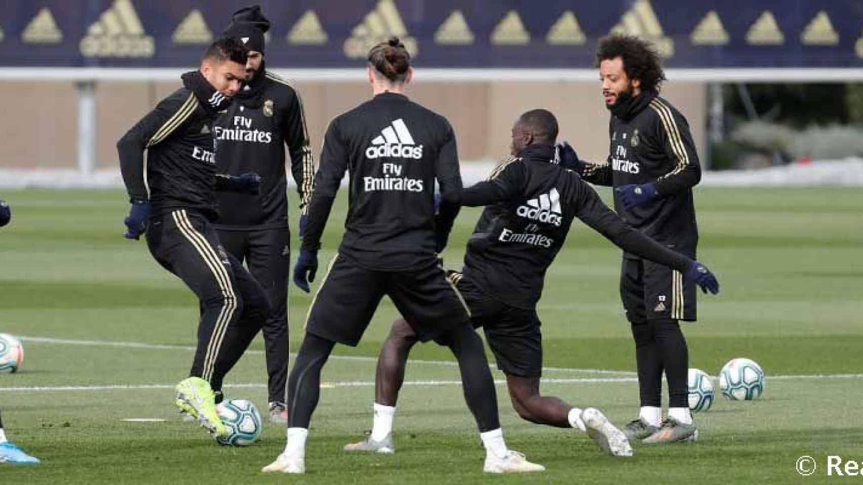 Los jugadores del Real Madrid, durante el entrenamiento