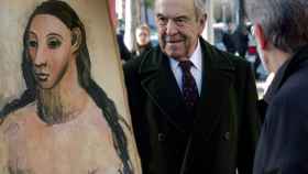 El cuadro 'Cabeza de mujer joven' de Picasso y el expresidente de Bankinter, Jaime Botín.