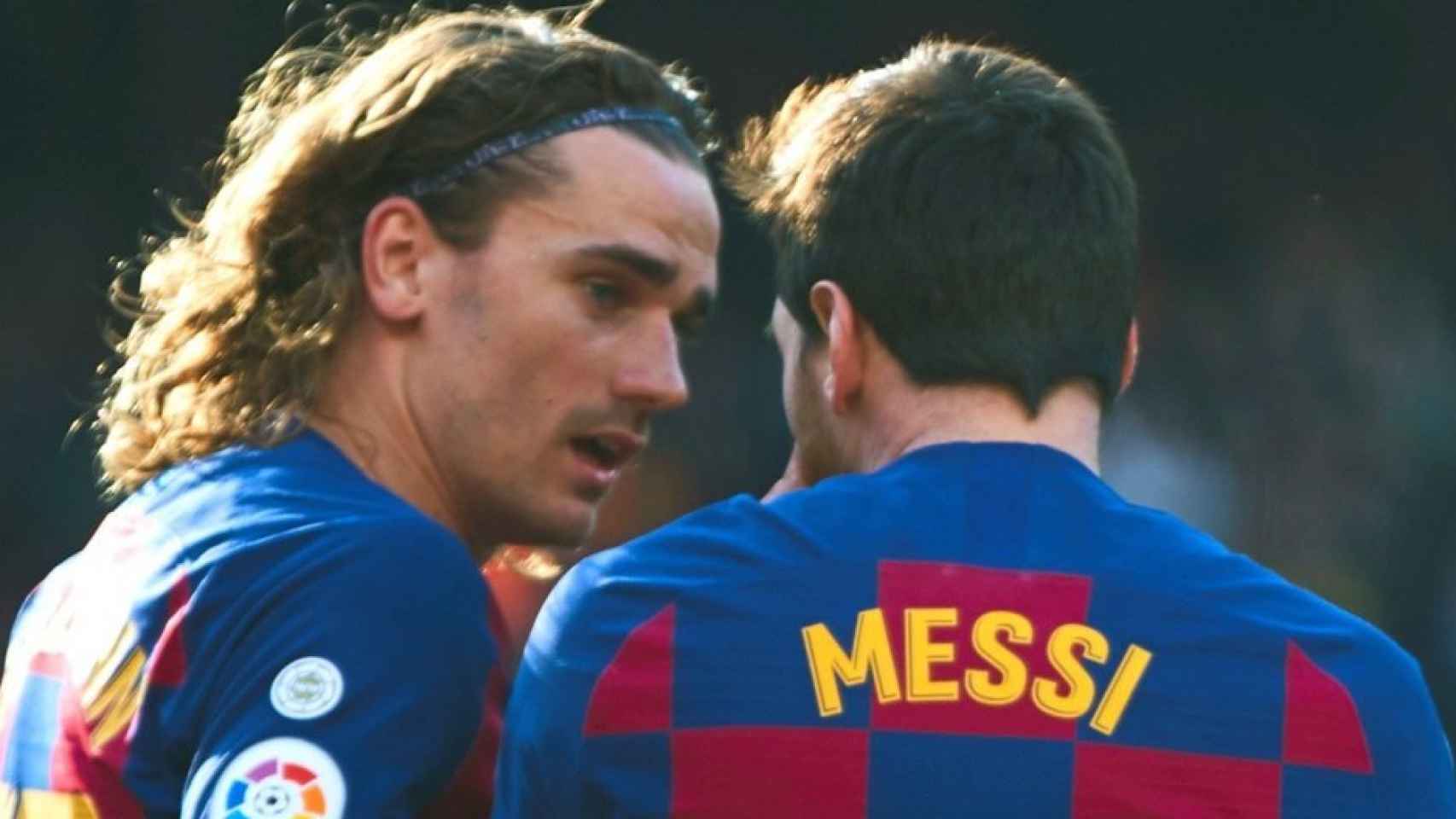 Antoine Griezmann y Leo Messi durante un partido.