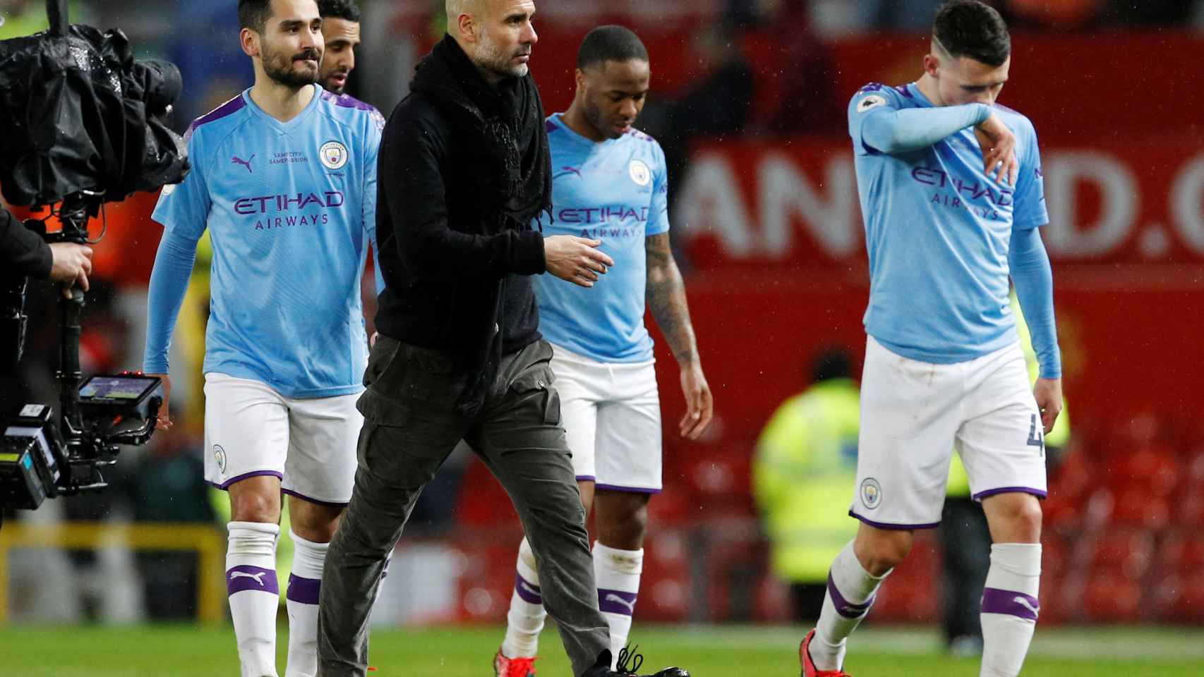 Pep Guardiola, Ilkay Gundogan, Raheem Sterling y John Stones, durante un partido del Manchester City