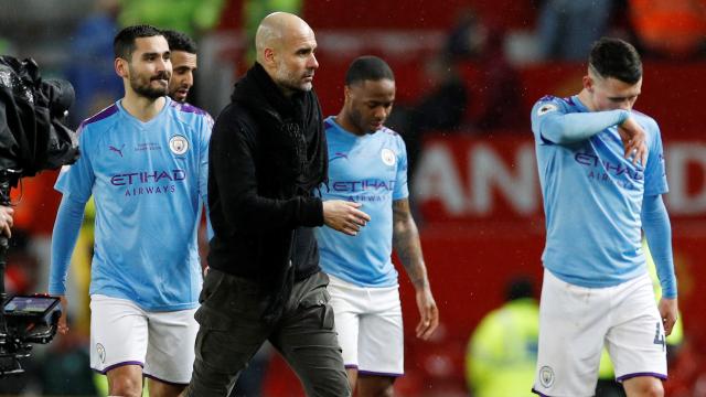 Pep Guardiola, Ilkay Gundogan, Raheem Sterling y John Stones, durante un partido del Manchester City