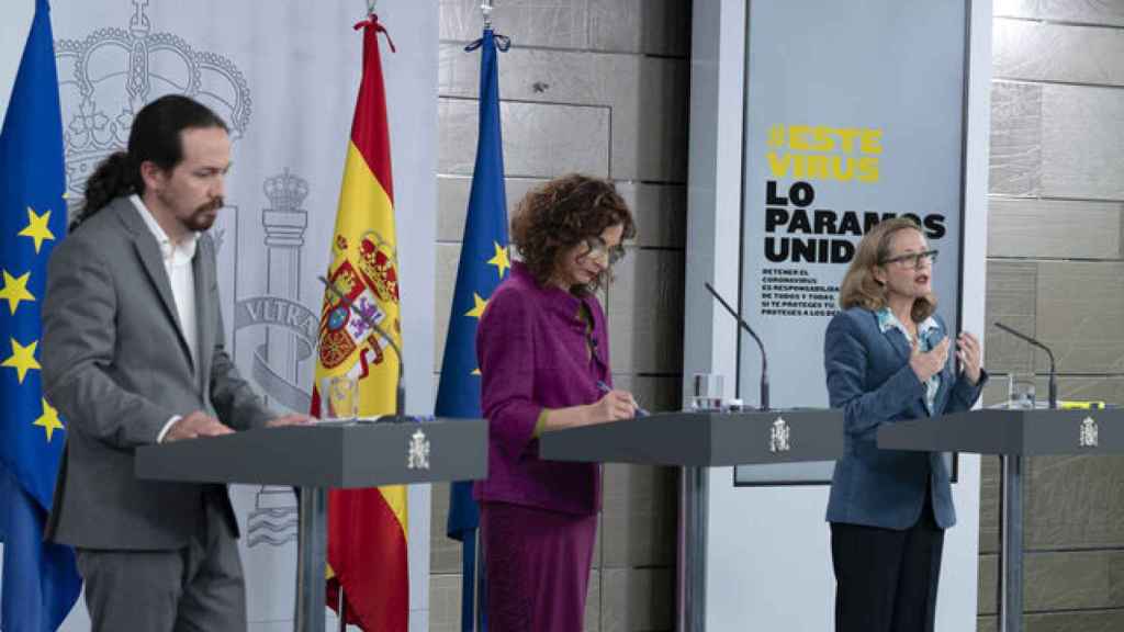 Pablo Iglesias, María Jesús Montero y Nadia Calviño en rueda de prensa.