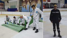 Soldados de la UME recogiendo el césped artificial del Palacio de Hielo. A la derecha, el comandante.