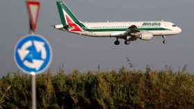 FILE PHOTO: An Alitalia Airbus A320 airplane approaches to land at Fiumicino airport in Rome, Italy
