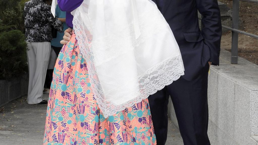 Luján y Carlos, en el bautizo de su hija.