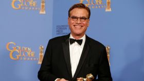 FILE PHOTO: Aaron Sorkin poses with the award for Best Screenplay - Motion Picture for Steve Jobs backstage at the 73rd Golden Globe Awards in Beverly Hills