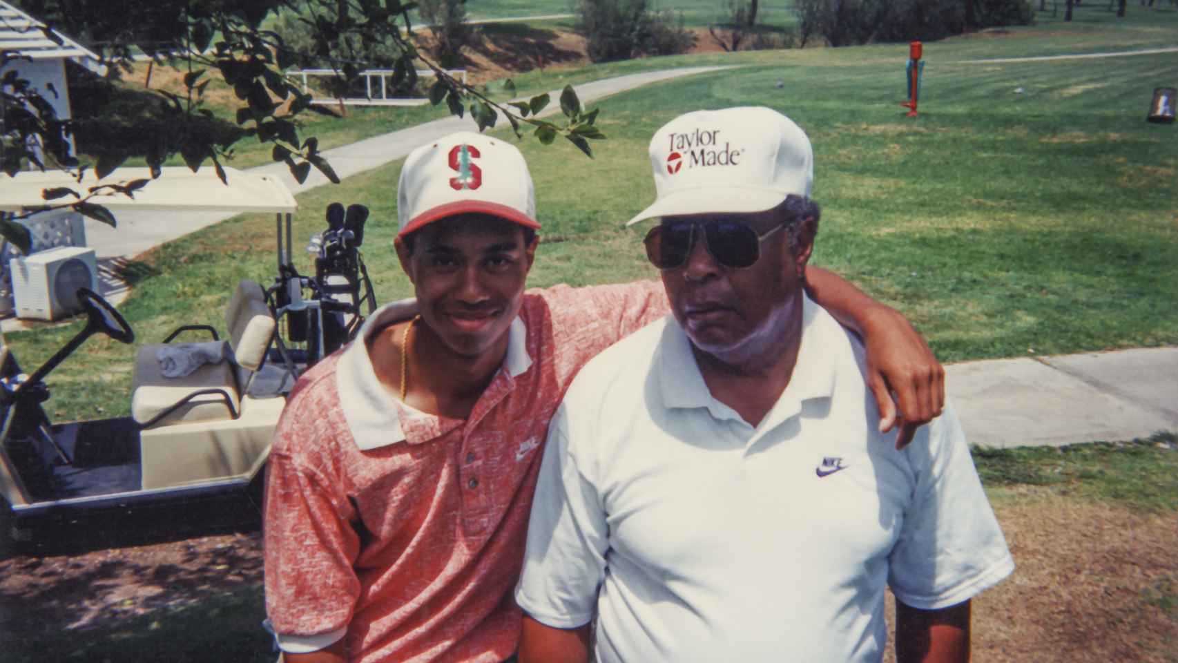 Tiger Woods junto a su padre Earl.