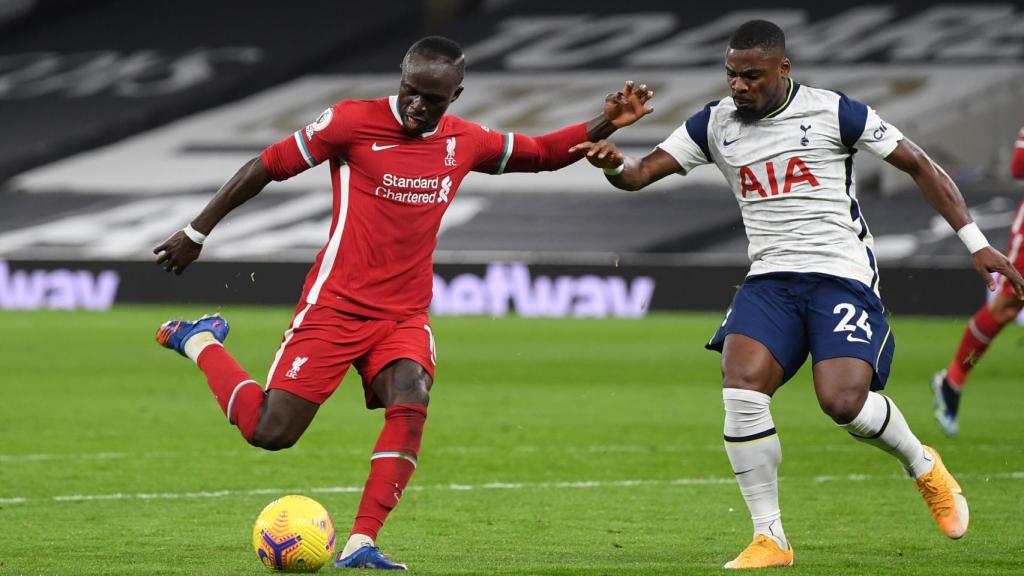 Aurier defends an action against Sadio Mane