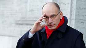 FILE PHOTO: Italy's Prime Minister Enrico Letta gestures as he leaves his house in downtown Rome