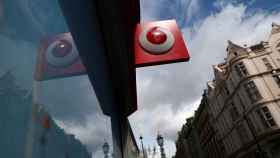 FILE PHOTO: A branded sign is displayed on a Vodafone  store in London