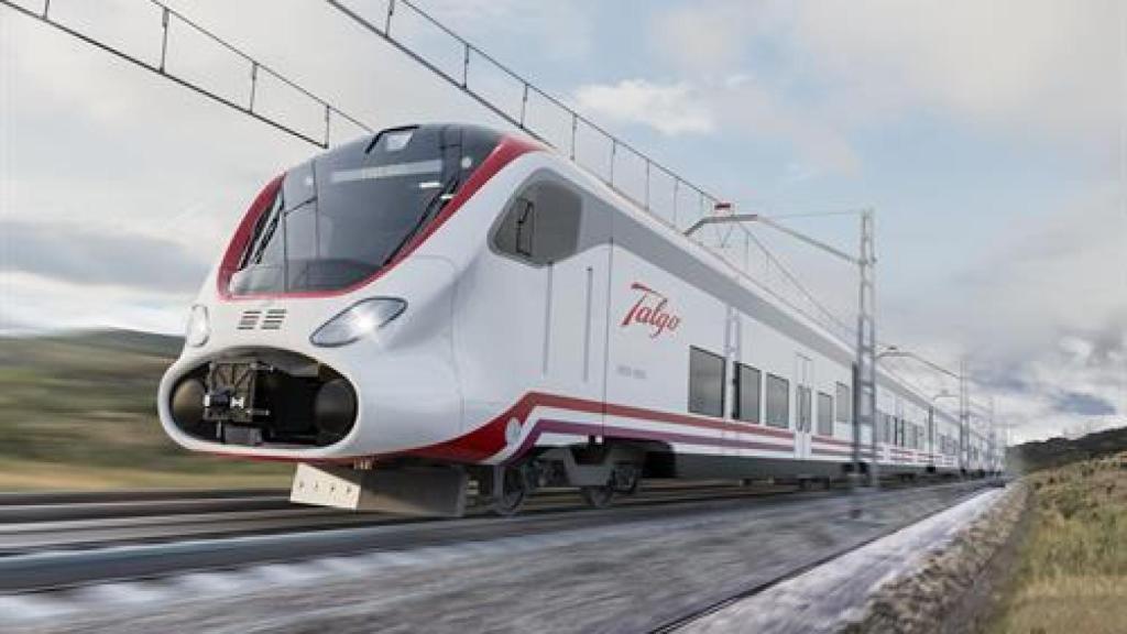 Un tren de Talgo circula por una vía férrea.