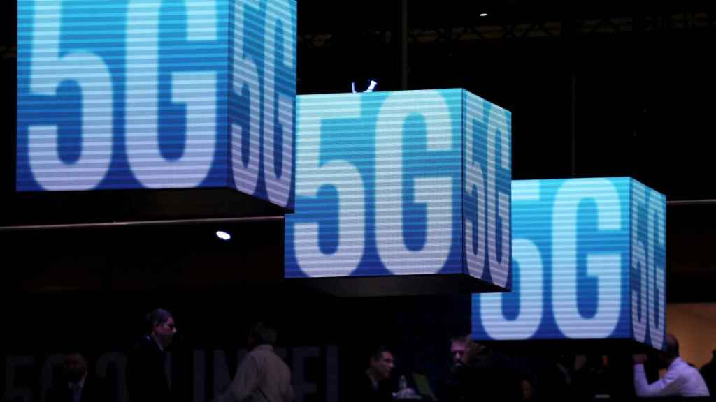 FILE PHOTO: Hanging cubes display 5G logo at the Mobile World Congress in Barcelona