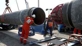 FILE PHOTO: Workers are seen at the construction site of the Nord Stream 2 gas pipeline, near the city of Kingisepp, Russia