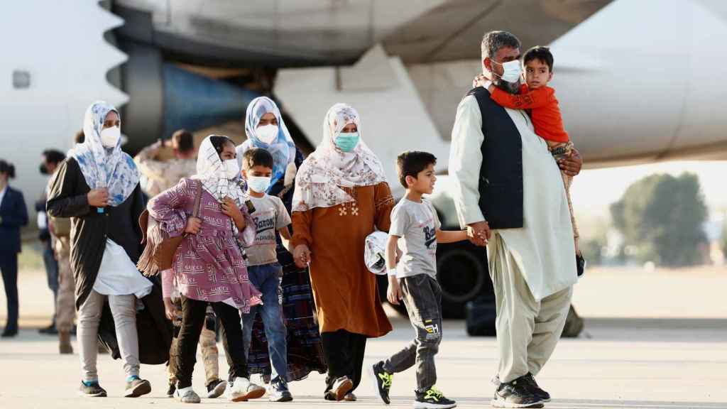 Afghan evacuees arrived at Torrejon base.