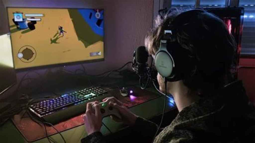 An image of a young man playing video games.