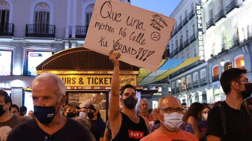 A protester holds a poster during the demonstration in Madrid.