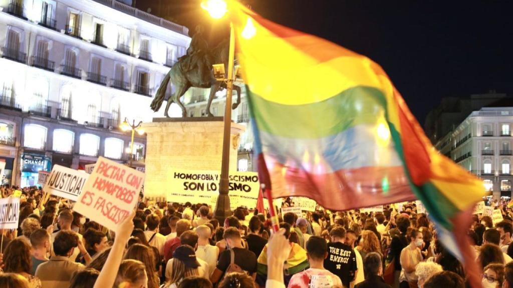 Protesters wave an LGTBI flag during the protest in Madrid.