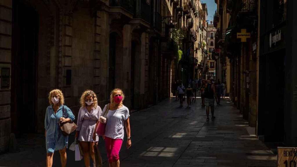 Tourists walking through the streets of Barcelona.