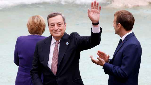 El primer ministro italiano, Mario Draghi, junto al presidente francés, Emmanuel Macron, y a la canciller alemana, Angela Merkel en el G20.